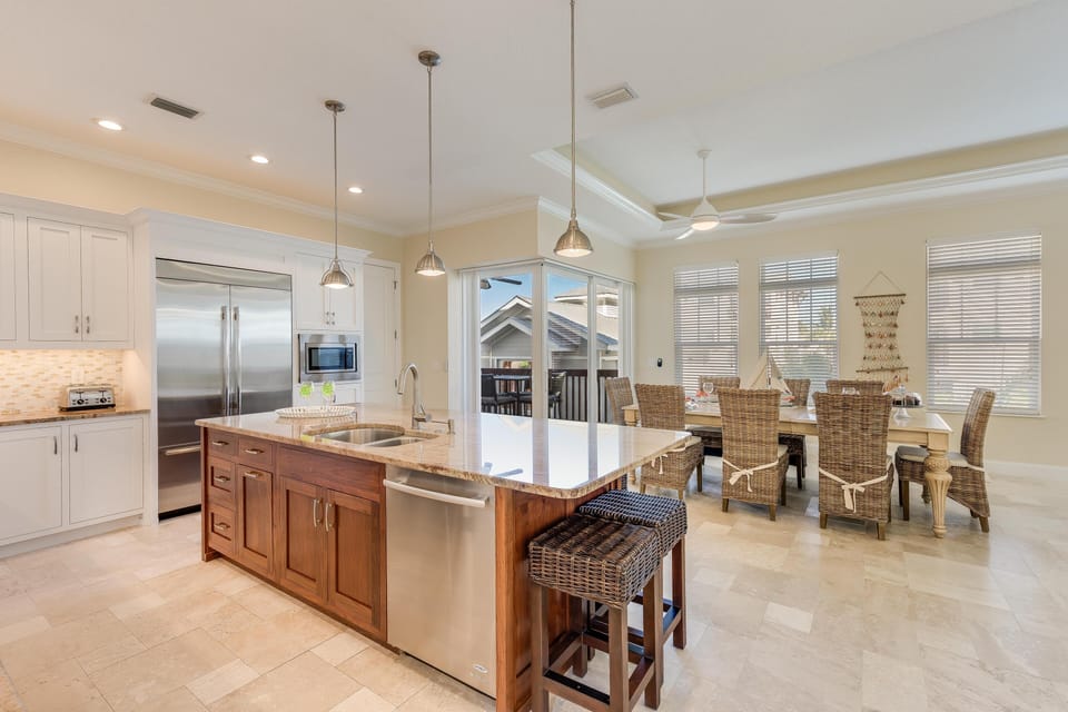 From sunrise coffee to sunset toasts, this stylish island and dining space invite effortless connection and casual coastal dining.