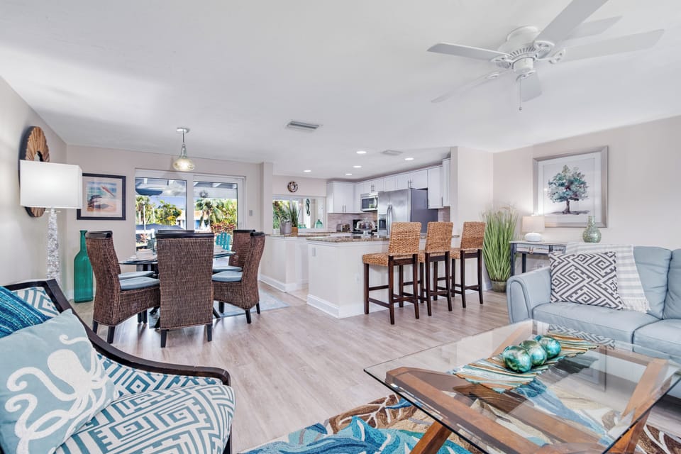 Share family meals around the dining table, just steps from the kitchen and overlooking the lanai.
