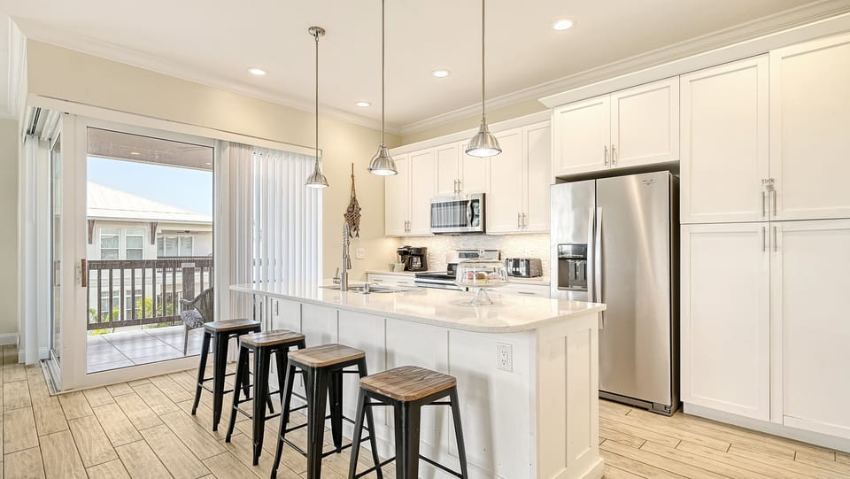 Whip up beach-day smoothies or sunset dinners—this airy kitchen brings style to every bite.