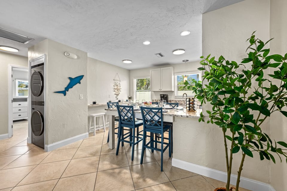 Share meals, late-night chats, or a tropical cocktail around this light-filled heart of the home.