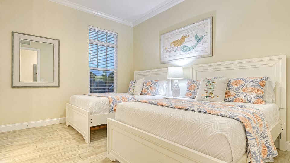 Bedroom 4 is a dreamy double-up for kids or friends—everyone gets their own space to stretch out.
