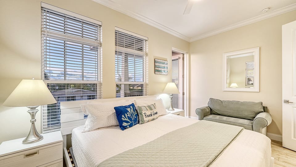 Bedroom 2 welcomes you with a serene ambiance, perfect for sinking into restful sleep after a day of beachside adventures.
