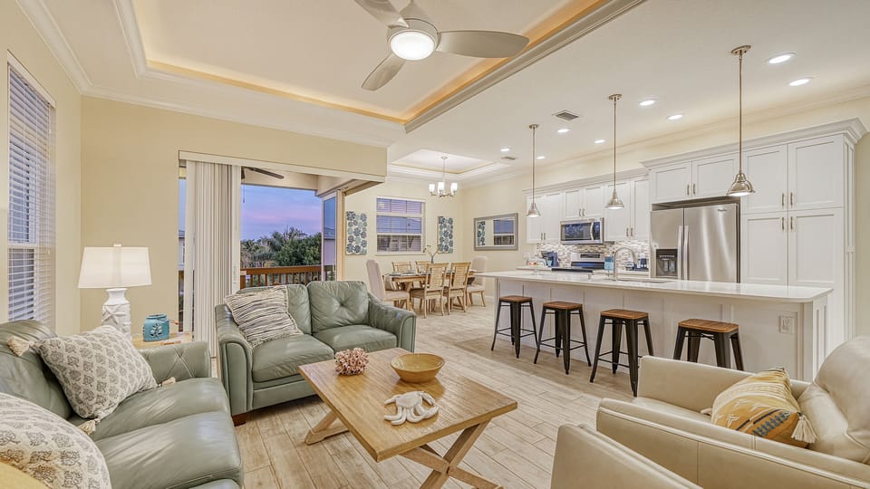 Gather around the expansive kitchen island, where chatter flows as easily as the coffee brews, setting the stage for memories made together.
