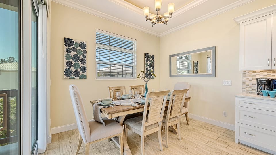 Share slow breakfasts or sunset dinners in this inviting dining space, where natural light and coastal charm set the perfect mood for every meal.