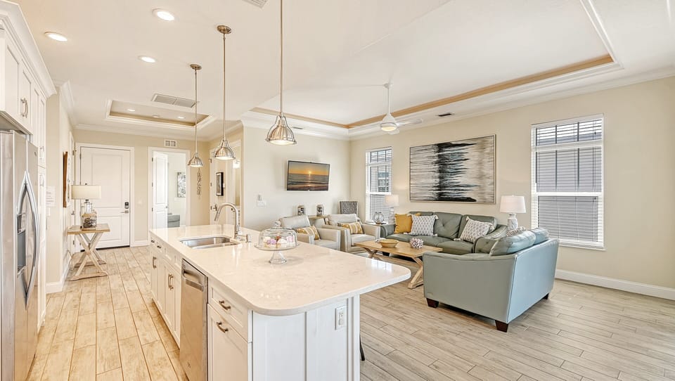 The heart of the home pulses here—where gourmet delights meet laughter-filled gatherings in a seamless flow.