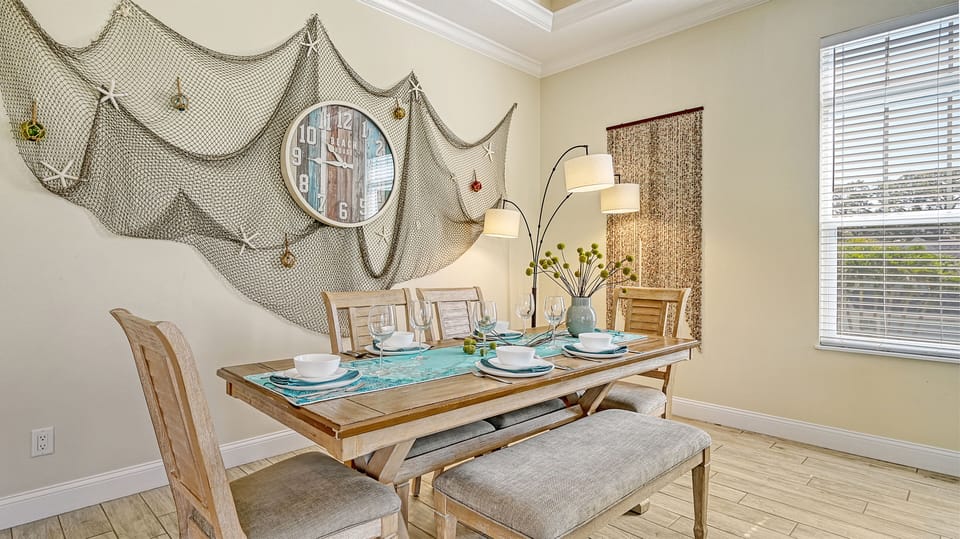 Gather 'round for coastal-inspired meals, lingering conversations, and relaxed island vibes in this inviting dining space.