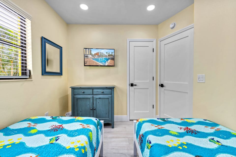 Bedroom 2 with in-room television.