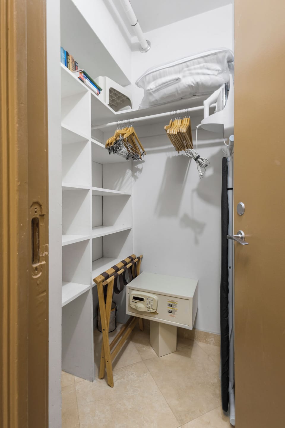 Your walk-in closet features organized shelving, hanging space with quality hangers, a personal safe for valuables, and even a luggage rack for easy packing.