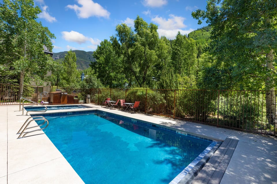 Relax during the summer by the pool and abundant greenery.