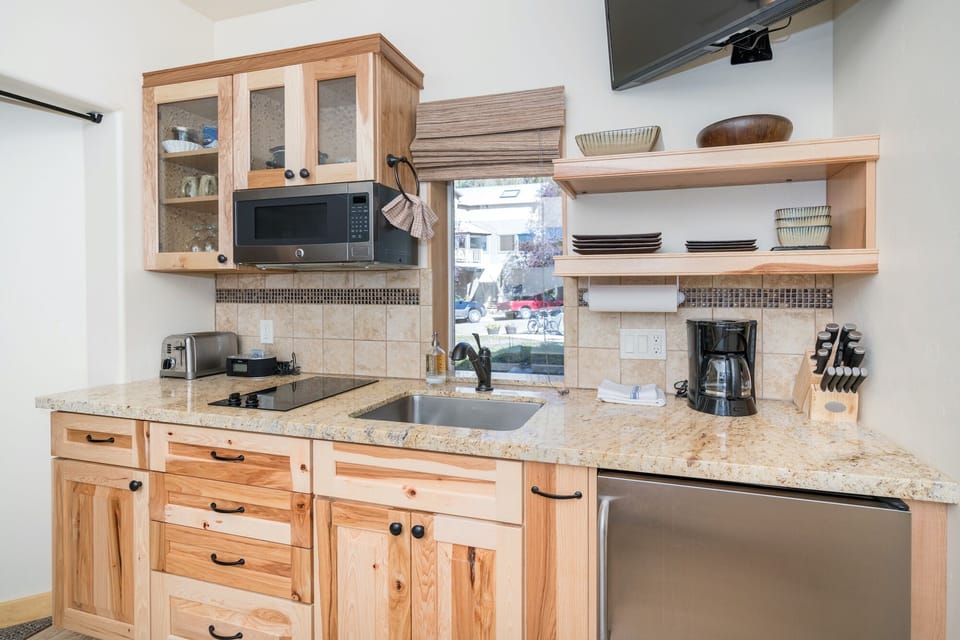 The kitchenette has a cooktop, microwave, toaster, coffee maker & mini fridge!  Great for all your basic cooking needs.
