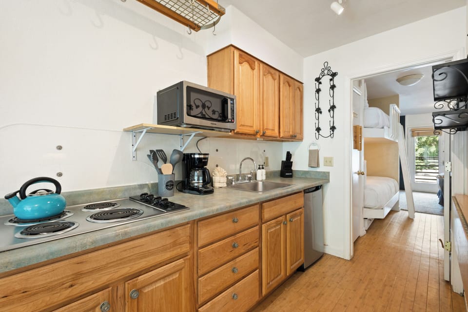 Galley Kitchen with mini fridge.