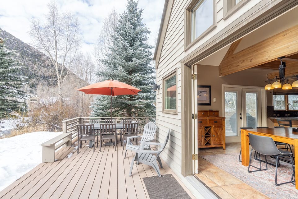 The 900sf deck is the highlight of this gorgeous property with river front views and grassy space for relaxing.