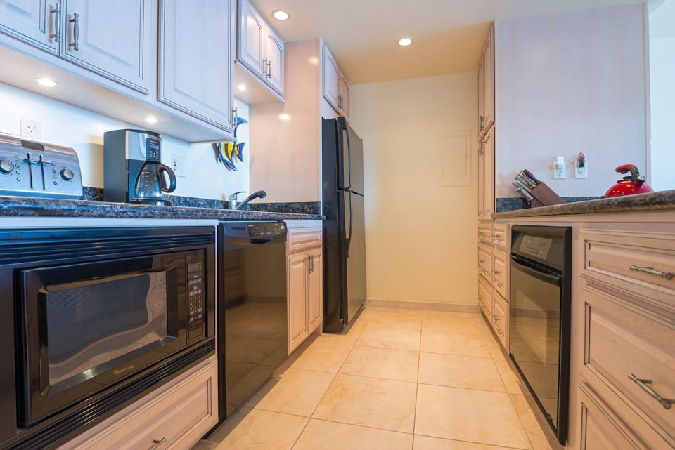 Contemporary detail with light wood cabinets and granite counter tops.
