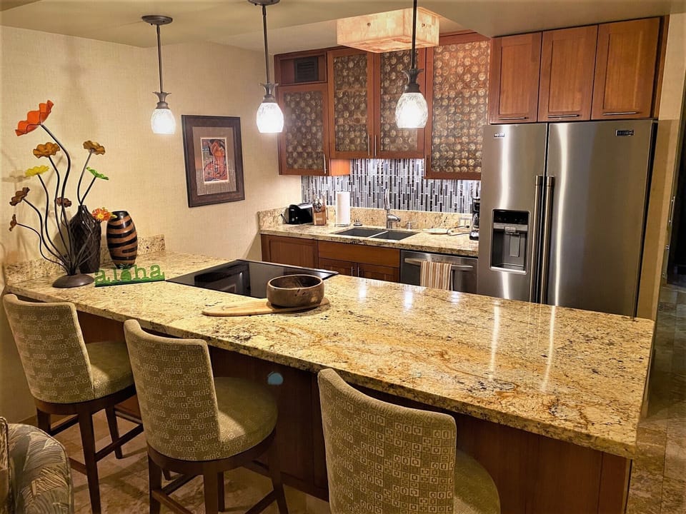 Gather around this gleaming granite island where your group can share meals, plan adventures, or simply sip morning coffee together in this fully equipped chef's kitchen.