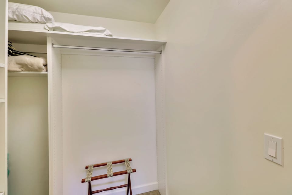 Keep things organized with built-in shelving and hanging space