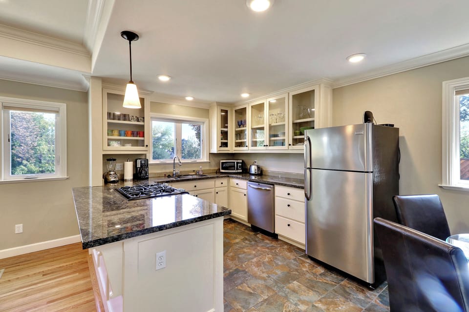 Gather at the granite island with room to prep