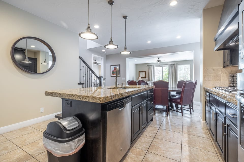 Kitchen - The kitchen is fully stocked with all the dishes, cookware, baking pans, and cutlery you will need for meal preparations and includes stainless steel appliances and granite counter tops.