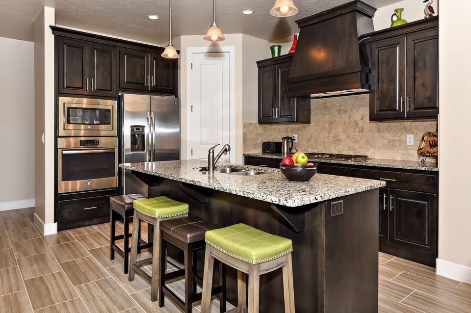Kitchen - The Kitchen is complete with everything you will need for meal preparations including pots, pans, baking dishes, plates, cups, silverware, cutlery, and an assortment of cooking utensils.