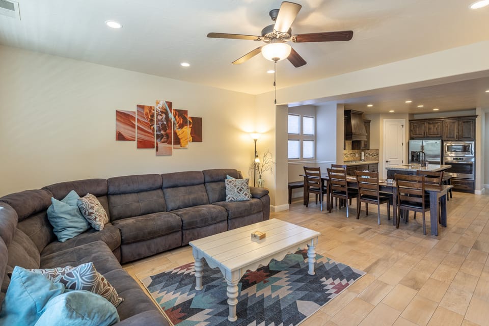 View of dining room and kitchen - The Living Room is located adjacent to the dining room and is the perfect place to relax and watch your favorite movie or TV program.