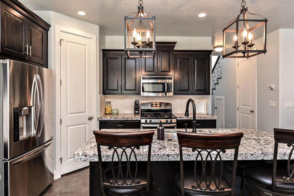 Kitchen - The kitchen is fully stocked with all the dishes, cookware, baking pans, and cutlery you will need for meal preparations and includes stainless steel appliances and granite counter tops.