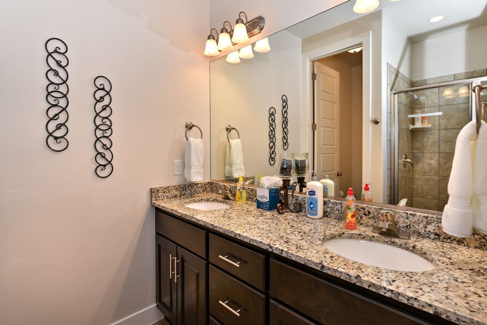 Main Bathroom - Main bathroom includes his and her sinks, toilet, large vanity and walk-in shower.