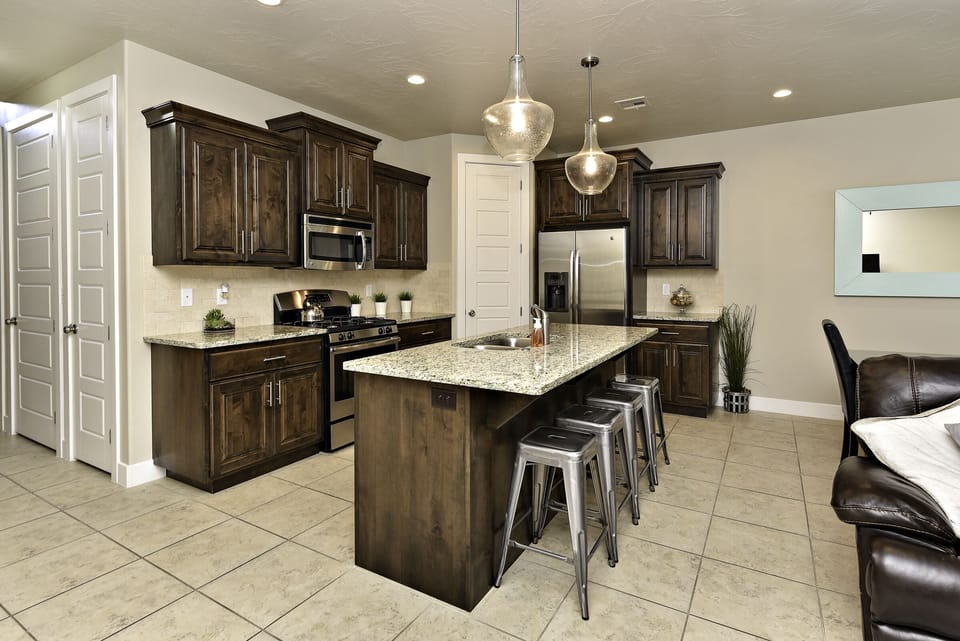 Kitchen - The Kitchen is complete with everything you will need for meal preparations including pots, pans, baking dishes, plates, cups, silverware, cutlery, and an assortment of cooking utensils