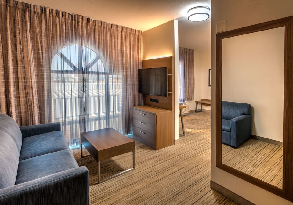 Suite, 1 King Bed, Jetted Tub | In-room safe, desk, iron/ironing board, free cribs/infant beds