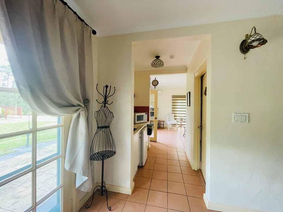 Deluxe Queen Pool View Room (Chardonnay) | Living area | Flat-screen TV, fireplace, DVD player