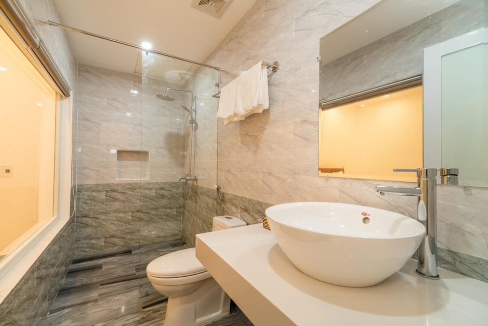 Shower, free toiletries, hair dryer, slippers