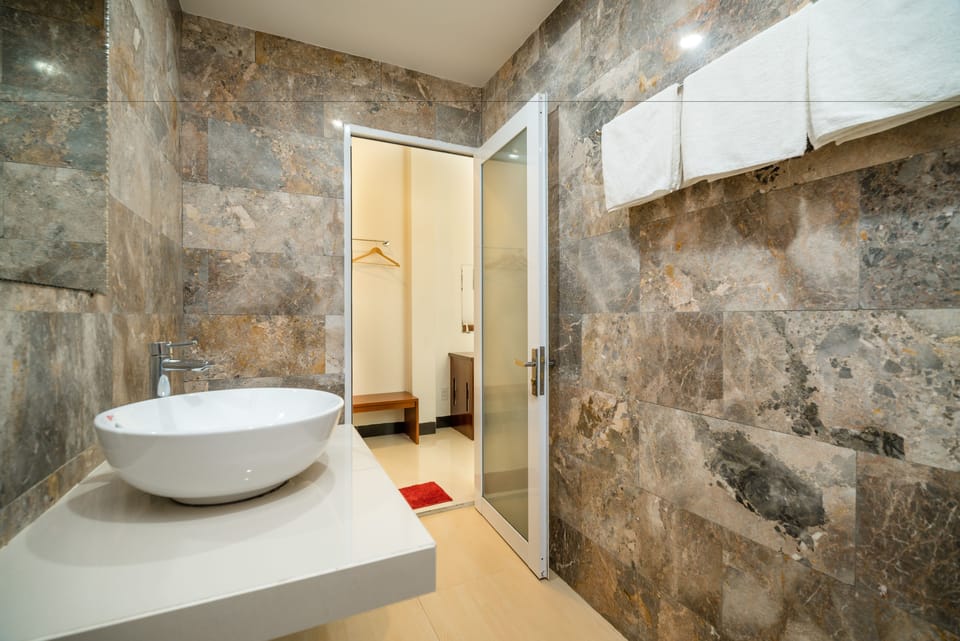Shower, free toiletries, hair dryer, slippers