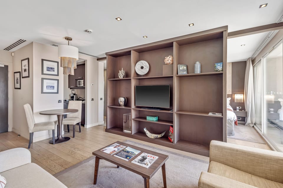 Deluxe Suite, 1 King Bed with Sofa bed | Living area | Flat-screen TV, DVD player