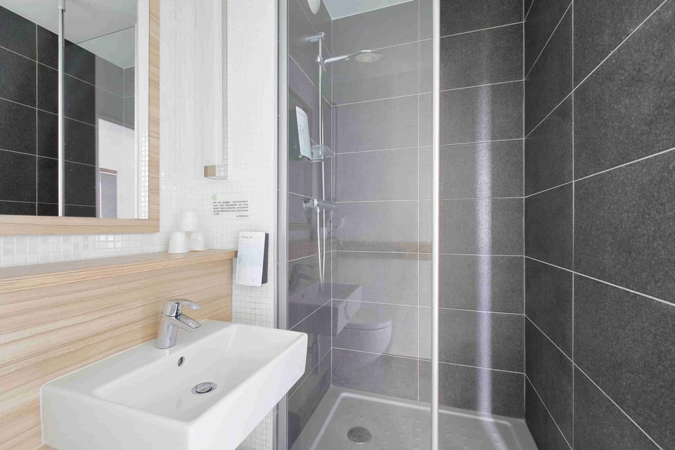 Shower, eco-friendly toiletries, hair dryer, towels