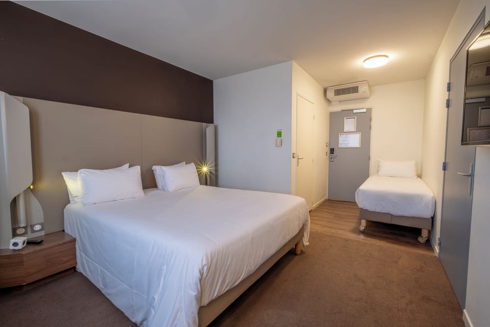 Standard Room, Multiple Beds | Premium bedding, individually furnished, desk, laptop workspace
