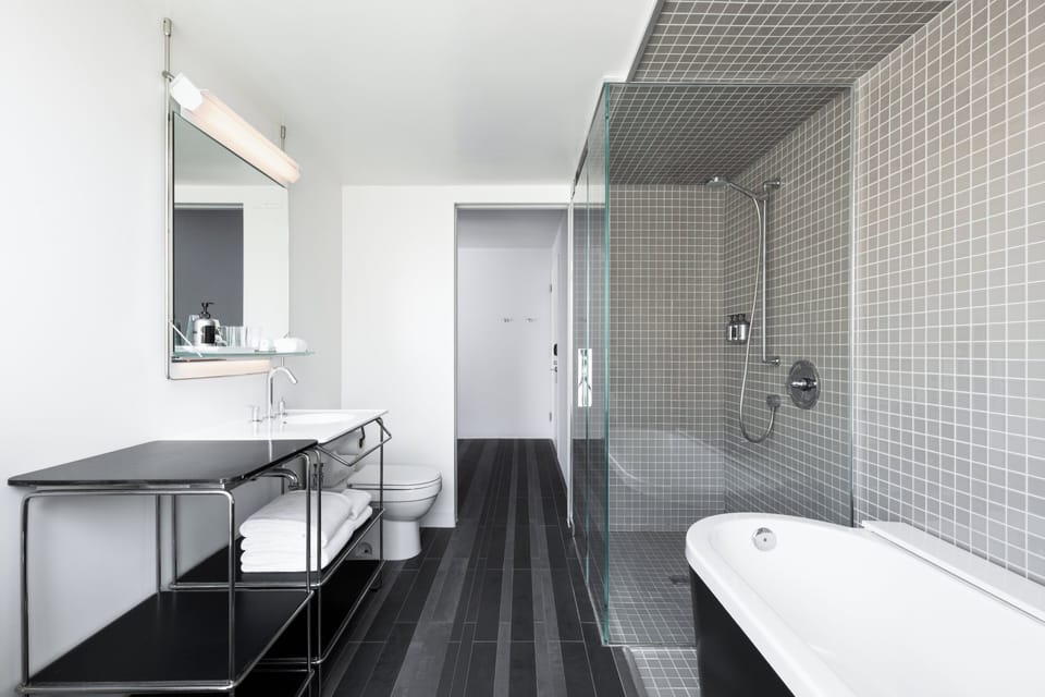 Premier Room, 1 King Bed | Bathroom | Designer toiletries, hair dryer, bathrobes, slippers