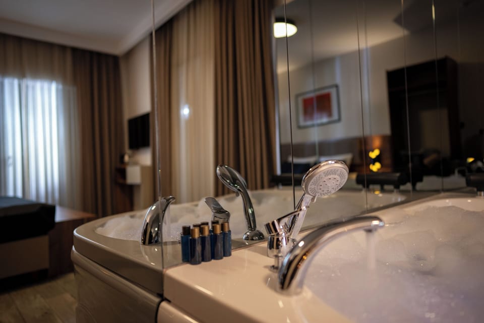 Elite Studio Suite, City View | In-room safe, desk, laptop workspace, iron/ironing board