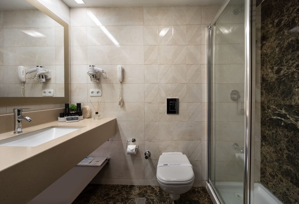 Shower, rainfall showerhead, eco-friendly toiletries, hair dryer