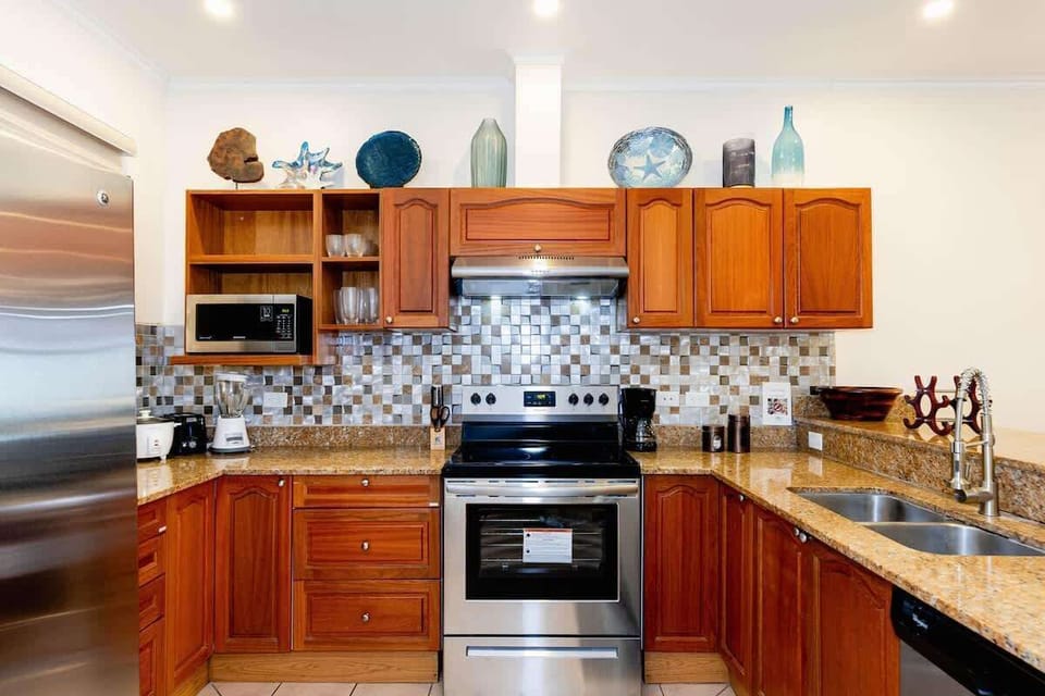 Newly remodeled gourmet kitchen, stainless steel appliances, granite countertops