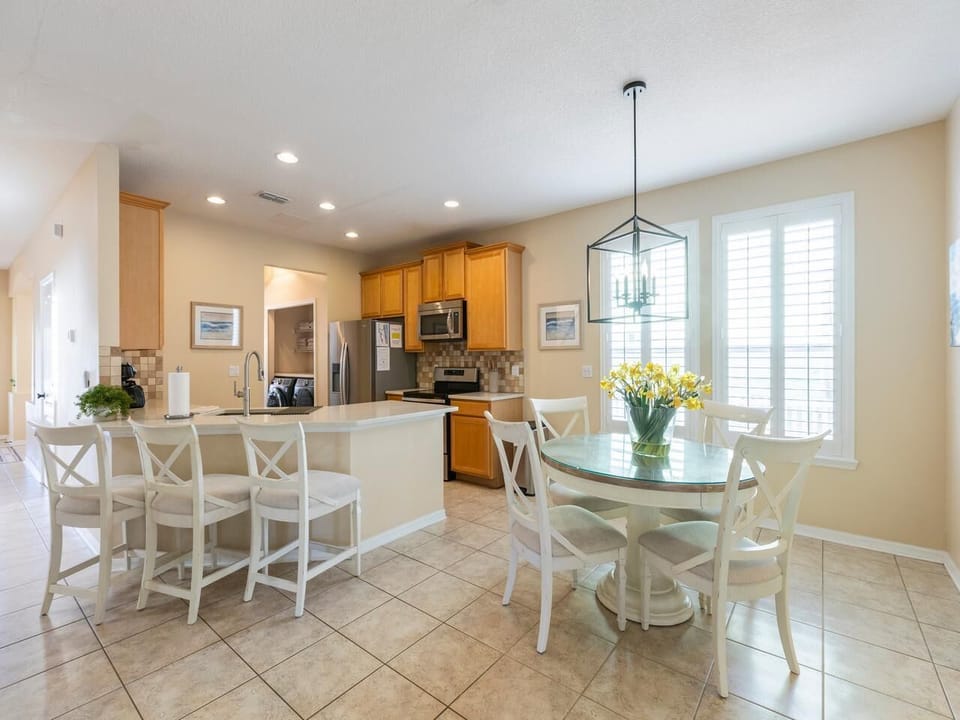 Bright, airy kitchen and breakfast room with pool view!
