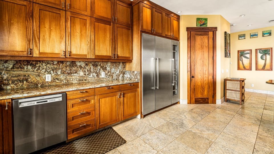 Spacious Kitchen with stainless steel appliances - please note - the fridge has changed to a standard french door.
