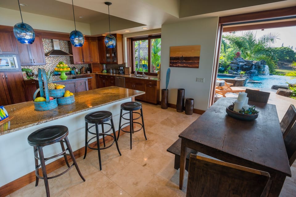 Gourmet Kitchen with table and bar-style seating.