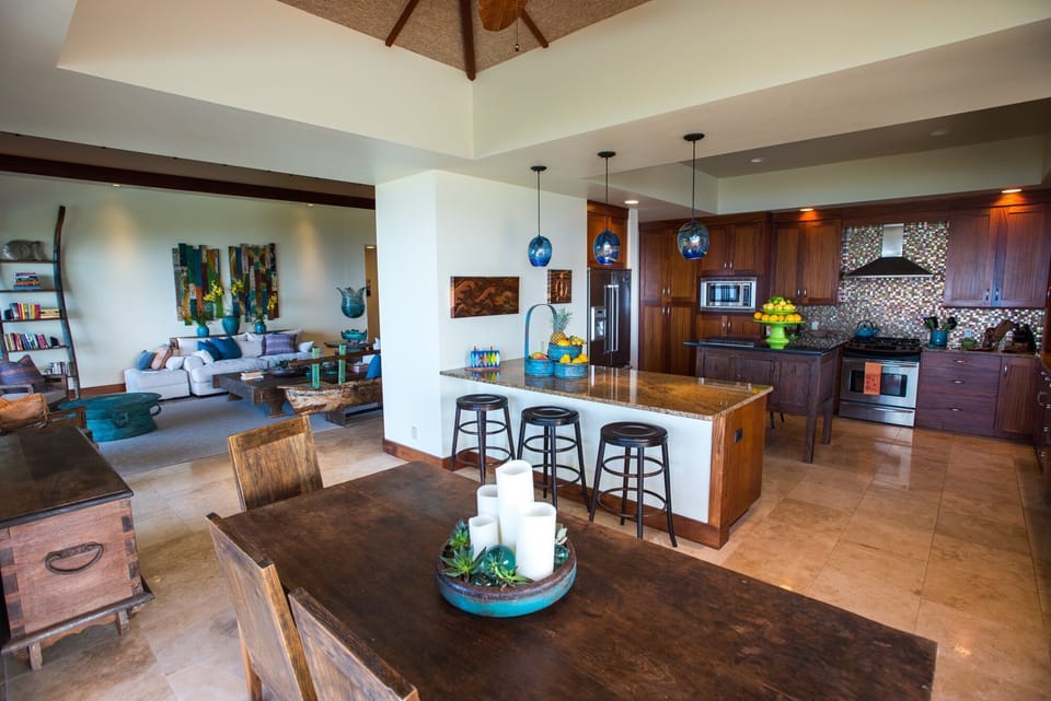 Dining Area with table and breakfast bar seating.