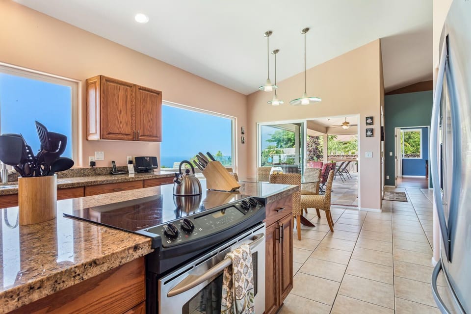 Kitchen with nearby dining room table.