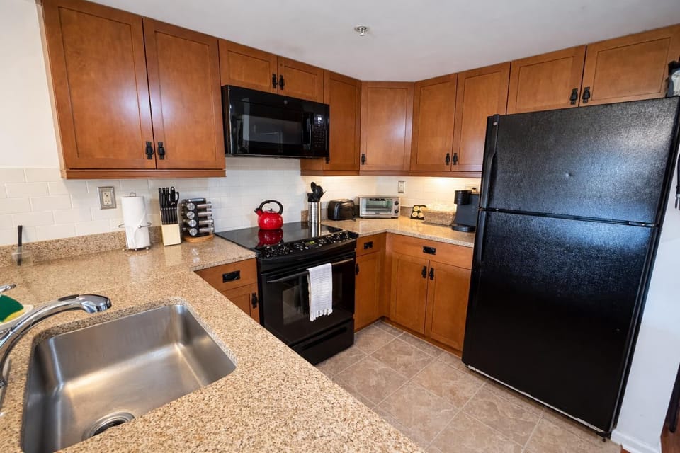 Fully equipped kitchen with modern appliances and ample counter space