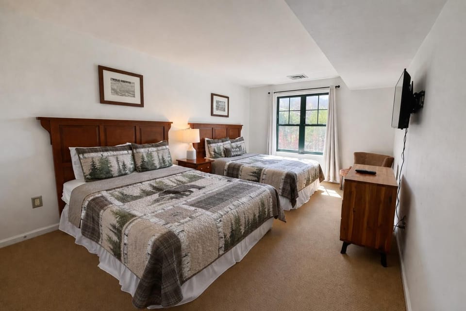 Spacious bedroom with cozy beds and natural light