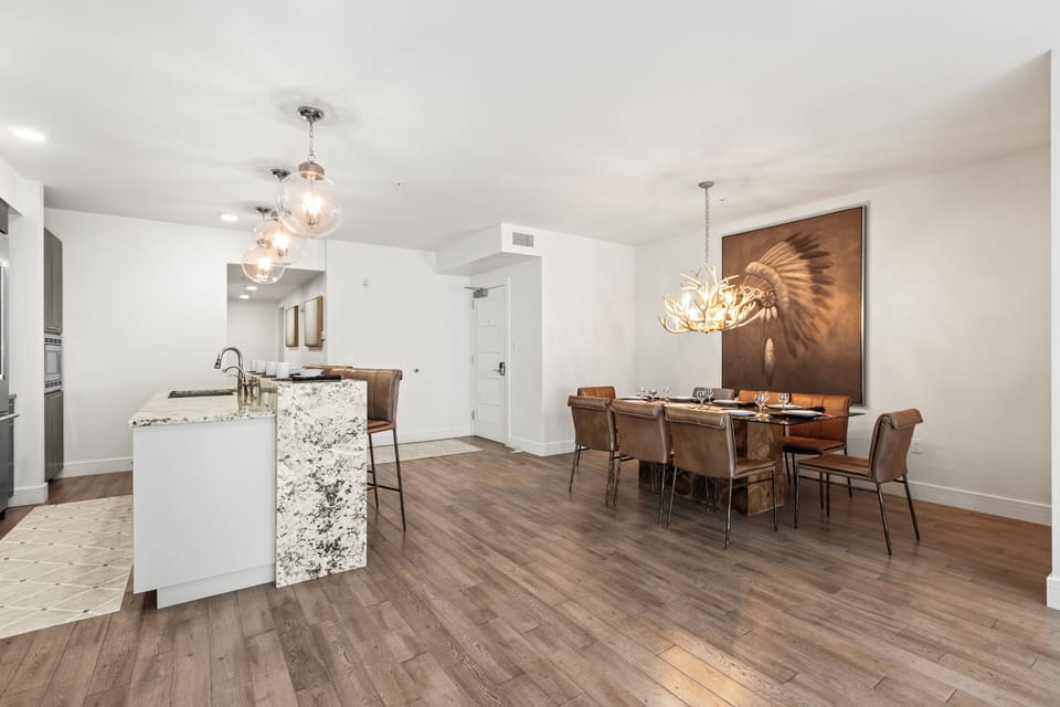 The open concept kitchen and dining area are spacious and bright.
