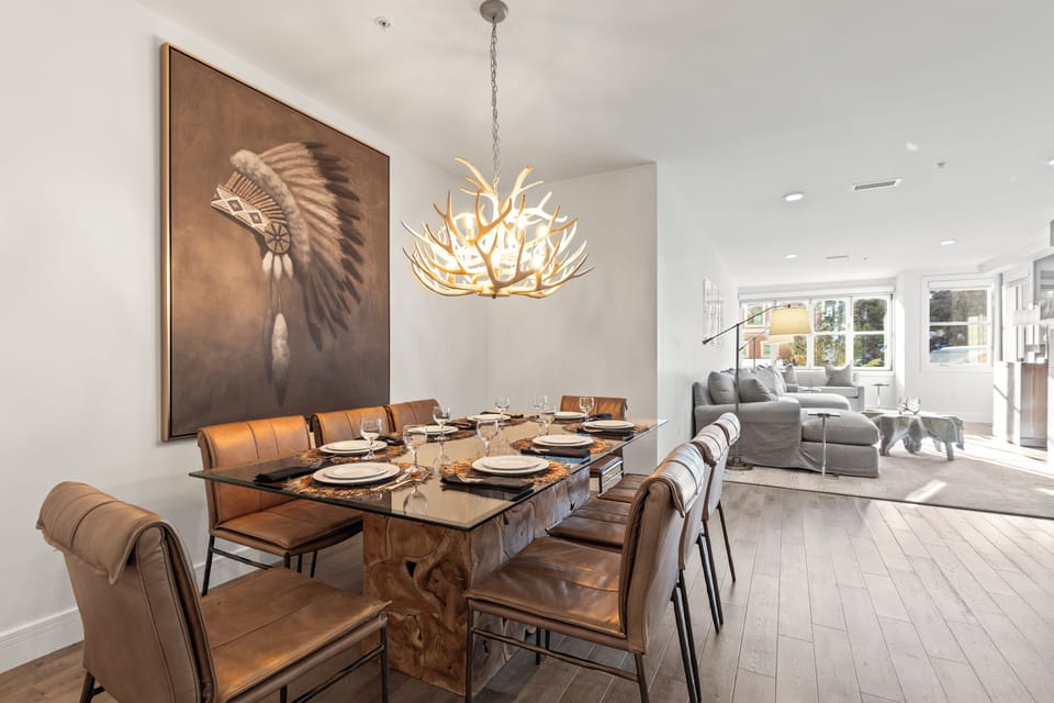 Rio Grande 203 has a dining table with seating for 8, stylish art and antler chandelier.