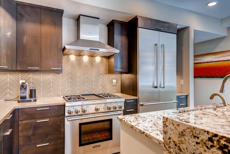 204 has a gourmet kitchen with stainless steel appliances and granite counters.