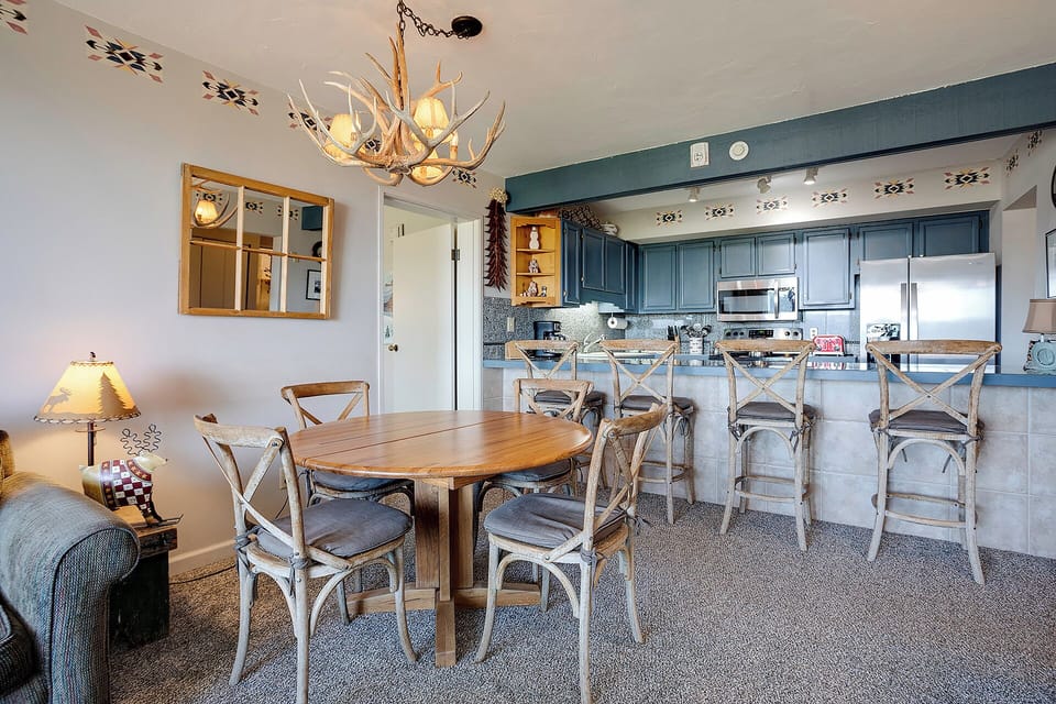 Gather around your rustic dining table for memorable meals, then chat at the kitchen island with its cozy bar seating.