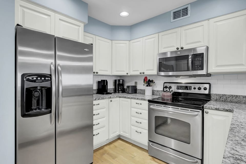 Updated kitchen with stainless steel appliances.