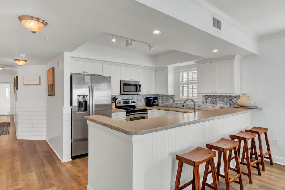 Kitchen with barstool seating.